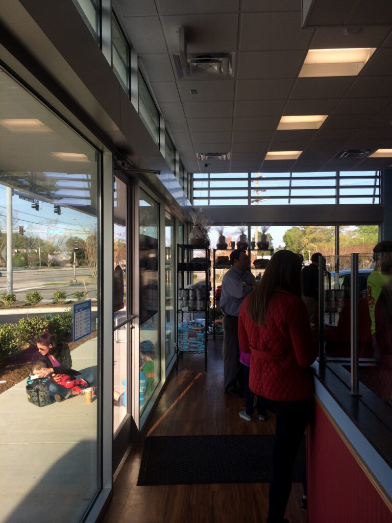 People inside Duck Donuts store